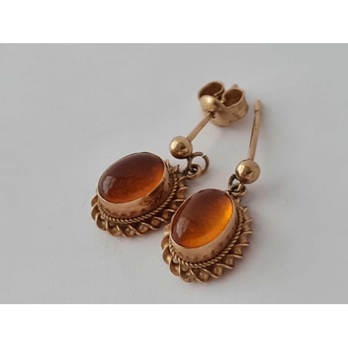 30 - A pair of amber earrings 9ct