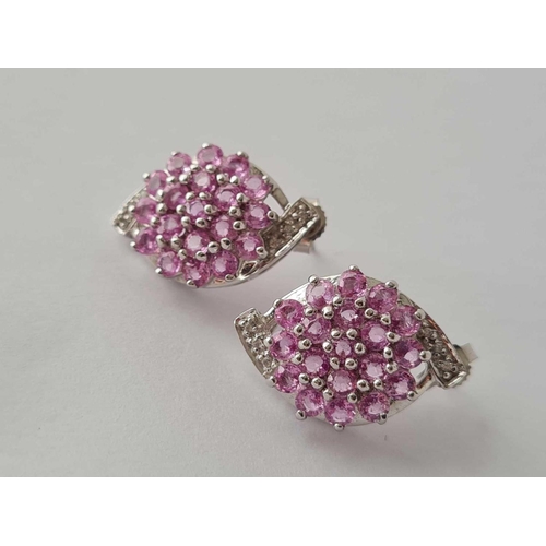 301 - A pair of pink sapphire & diamond 9ct white gold earrings 7.6g