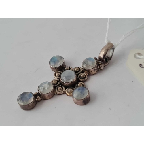 318 - A attractive cross pendant mounted with six moonstones