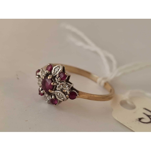 339 - A fancy ruby and diamond 9ct cluster ring size K 1.4g inc