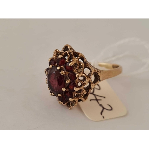 342 - A dome shaped garnet cluster ring 9ct size R 4.8g inc