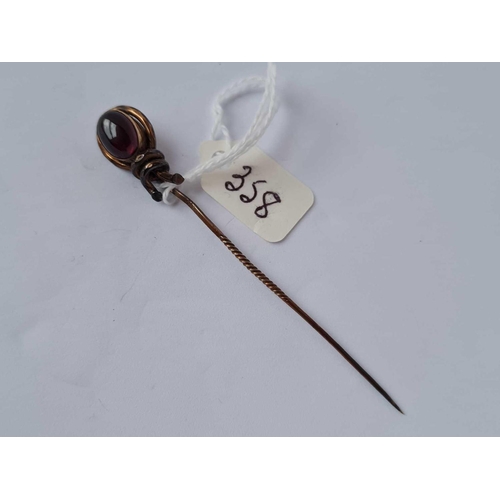 358 - A gold and cabochon garnet topped stick pin   2.4 gms