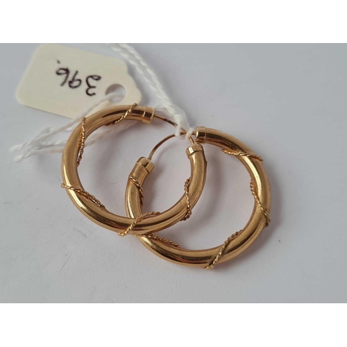 396 - A pair of rope design hoop earrings 9ct    1.8 gms