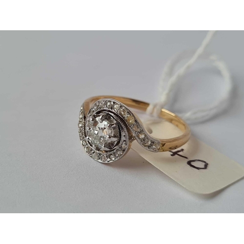 40 - A EDWARDIAN SPIRAL DESIGNED DIAMOND RING WITH ROSE DIAMONDS AND A CENTRAL OLD CUT DIAMOND WEIGHING 0... 