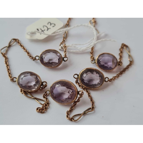 423 - A gold neck chain with amethyst beads 9ct 16 inch