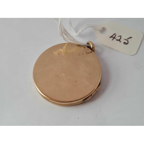 425 - A circular locket 9ct    9.1 gms