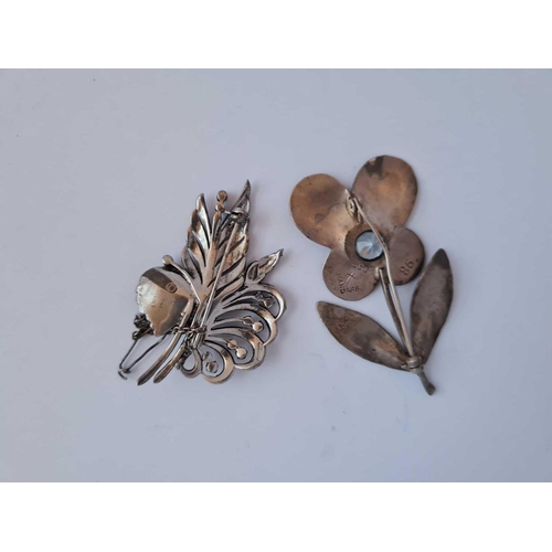 439 - A continental silver designer flower brooch with central stone marked ARB No 86 together with a silv... 