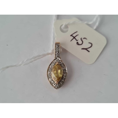 452 - A yellow sapphire and diamond pendant 9ct  1.7g