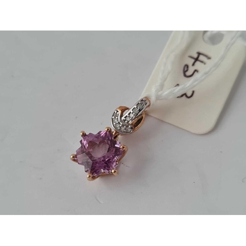 453 - A amethyst and diamond star pendant 9ct