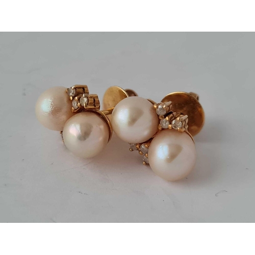 454 - A pair of pearl and diamond earrings 18ct gold     6.1 gms