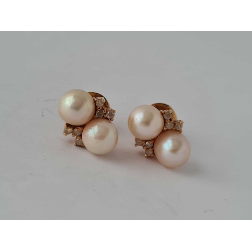 454 - A pair of pearl and diamond earrings 18ct gold     6.1 gms