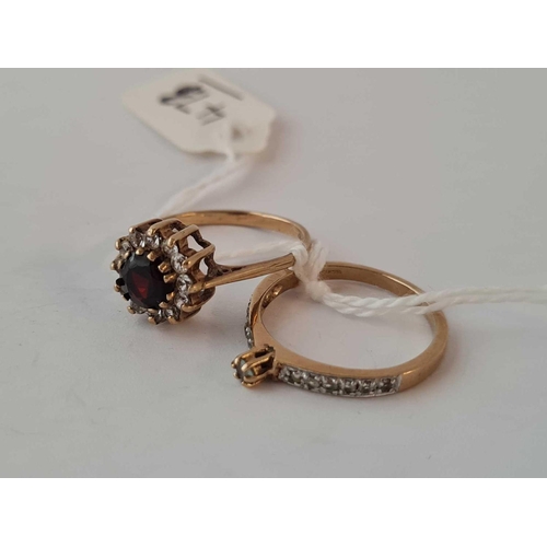 473 - A garnet set and white stone set rings both 9ct    4.1 gms