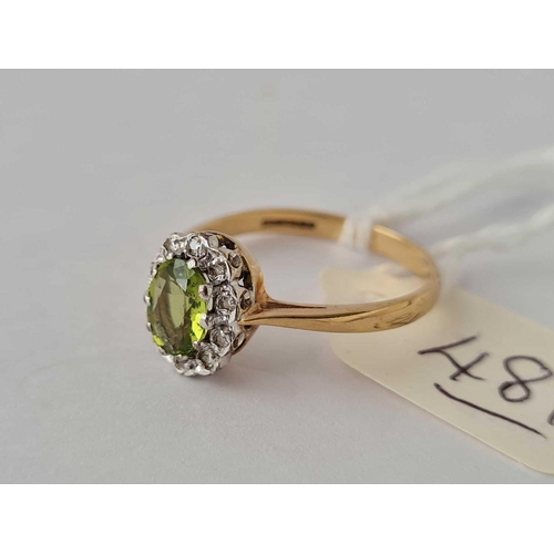 481 - A peridot and diamond cluster 9ct dress ring size O 2.2g inc