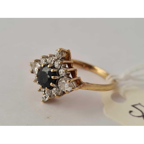 506 - A multi stone dress ring in 9ct size K 3.1g