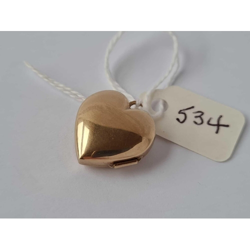 534 - A heart shaped locket set with a diamond 9ct