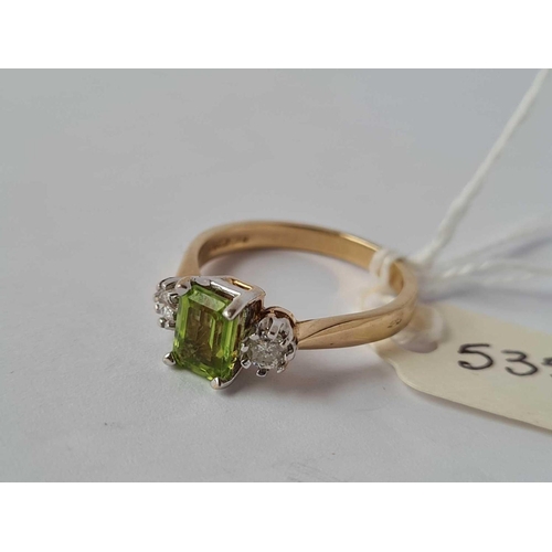 535 - A diamond and peridot three stone ring 9ct size O