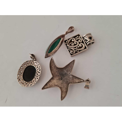 579 - Four stone set Silver  pendants