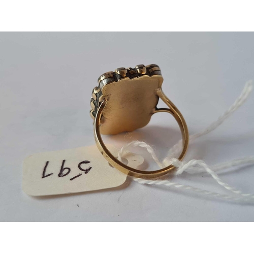 597 - A antique memorial ring with gold shank and locket top size N