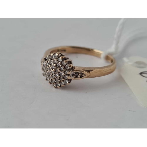 603 - A diamond cluster ring 18ct gold size N    2.5 gms