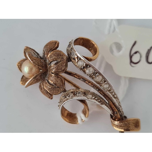 604 - A pretty silver gilt stone set and pearl flower brooch