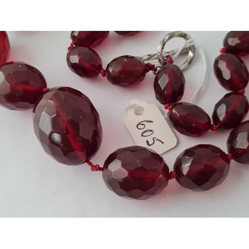 605 - A string of cherry coloured graduated beads