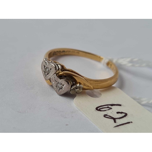 621 - A two stone diamond ring in heart setting 18ct gold size O    3.1 gms