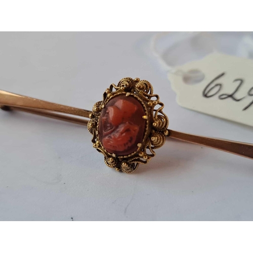 629 - A small gold cameo coral brooch