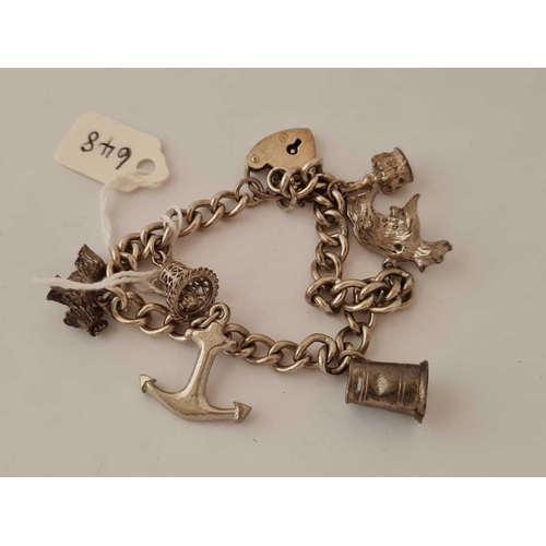 648 - A silver charm bracelet 33gms