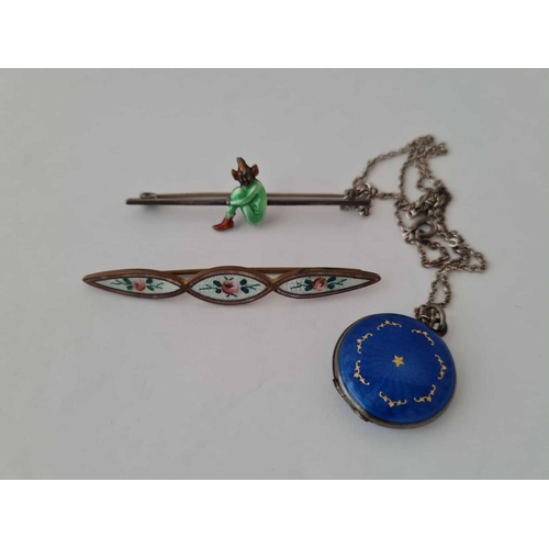 662 - A enamel locket and two enamel brooches