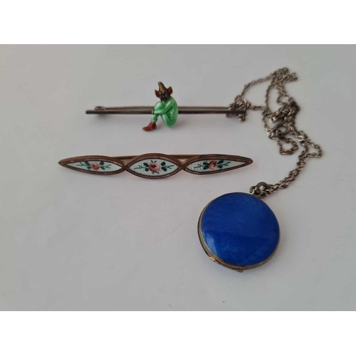 662 - A enamel locket and two enamel brooches