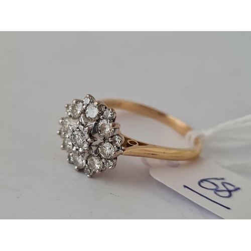 68 - A GOOD DIAMOND CLUSTER RING APPROX0.60ct diamonds in 18ct gold size T 5.6g