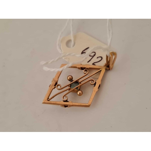 692 - A gold stone set pendant