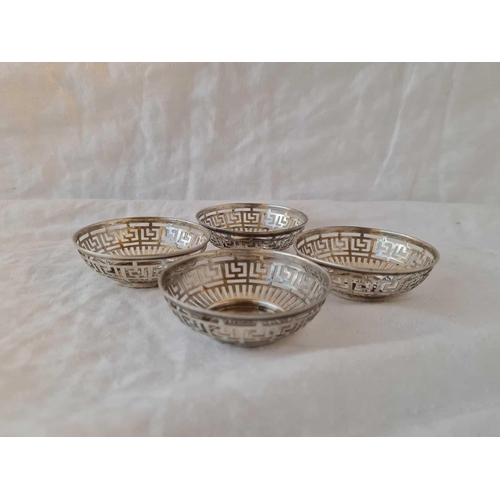 718 - A set of 4 circular dishes with pierced sides, 2.5