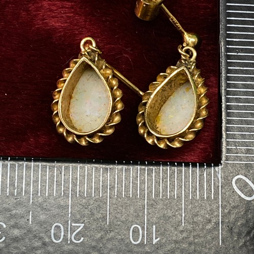 670 - A pair of opal drop earrings 9ct