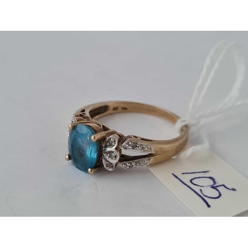 105 - A diamond and blue topaz 9ct ring size R 4.1g inc