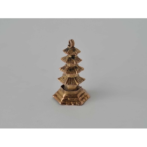 138 - A novelty charm in the form of a pagoda    1.1 gms