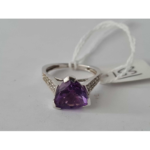 153 - A white gold triangular amethyst ring with diamond shoulder 9ct size O    4.3 gms