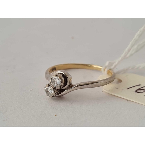 163 - A two stone diamond twist ring 20 points 18ct gold size O    1.8 gms