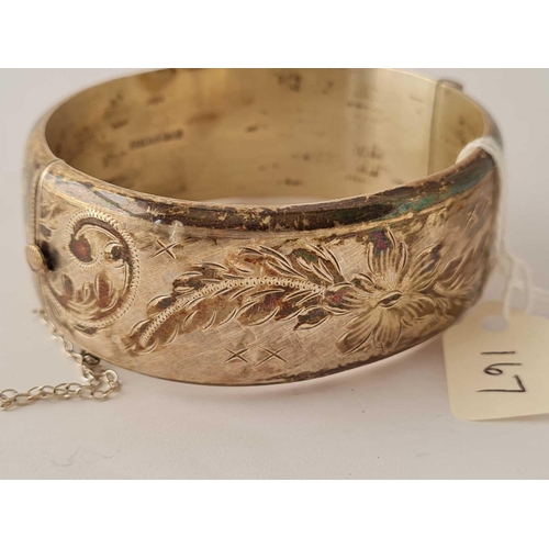 167 - A wide silver and engraved bangle   38 gms