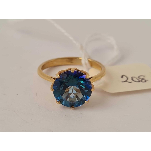 208 - A blue topaz ring 10mm diameter 9ct size N   2.9 gms