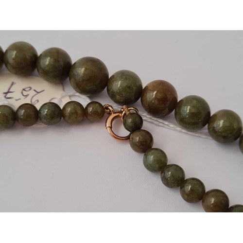 257 - A Vintage jade bead necklace with gold clasp 24 inch