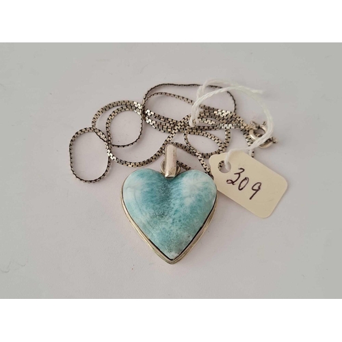 309 - A pretty heart shaped pale blue agate pendant on silver chain