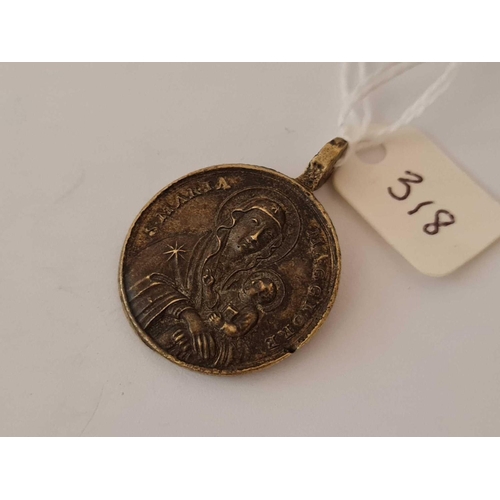 318 - 18th century brass pendant depicting Madonna & child and 2 religious figures to the reverse.