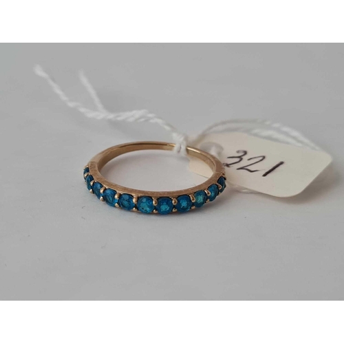 321 - A blue stone half hoop ring 9ct size O