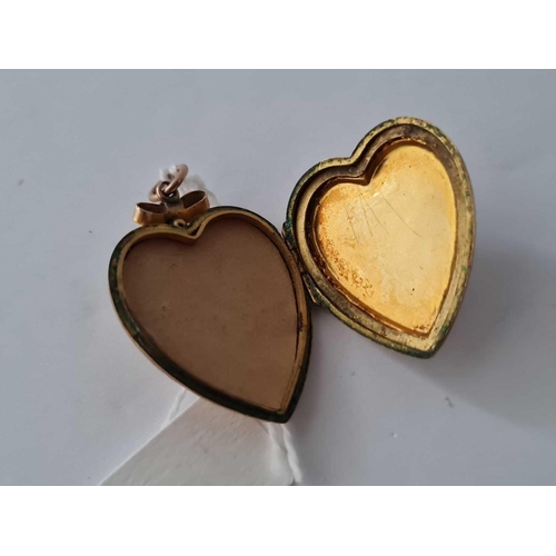 337 - A 9ct back and front locket   4.9 gms