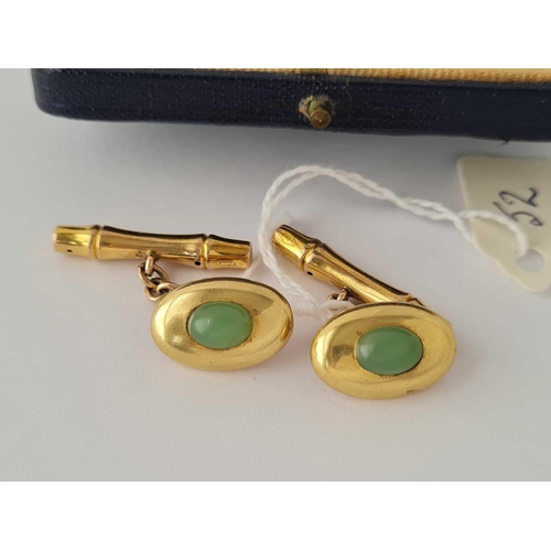 52 - A EDWARDIAN GOLD AND JADE SET CUFFLINKS IN HARRODS BOX