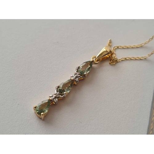 61 - A peridot and diamond 9ct necklace 1.6g inc