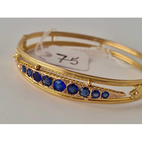 75 - Victorian detailed 9ct bangle set with blue stones possibly sapphires 7.8g inc