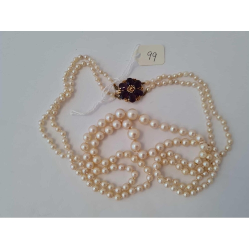 99 - A double strand pearl necklace with 9ct oval clasp 22 inch