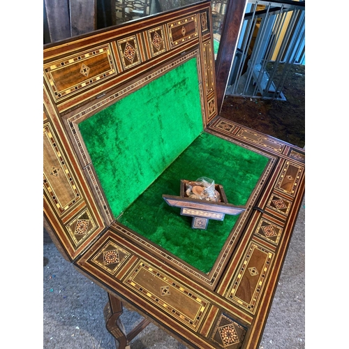 1718 - A 19th Century Moroccan inlaid games table with fitted interior